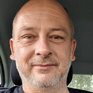 Detormentis Headshot 3 of 3