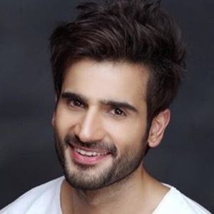 Karan Tacker Headshot 5 of 7