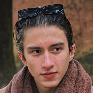 Saymon Robert Headshot 3 of 7